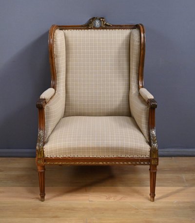 Wingback bergère armchair in walnut, Louis XVI style - Late 19th century