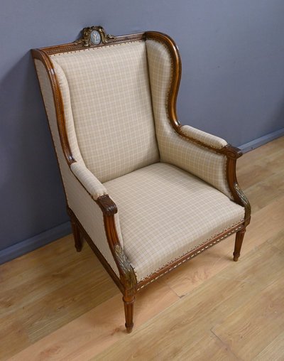Wingback bergère armchair in walnut, Louis XVI style - Late 19th century