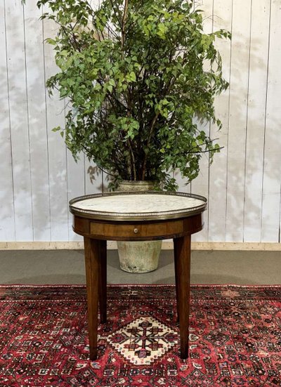 Louis XVI style bouillotte table in mahogany with a white marble top, dating from the 1930s