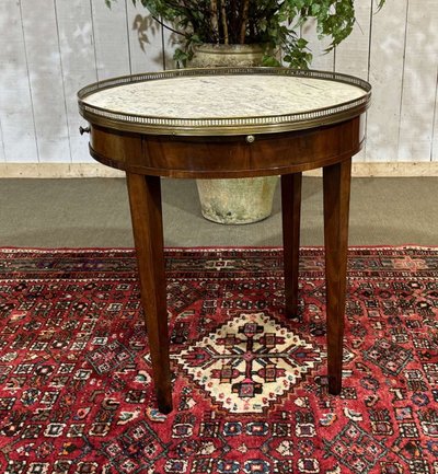 Louis XVI style bouillotte table in mahogany with a white marble top, dating from the 1930s