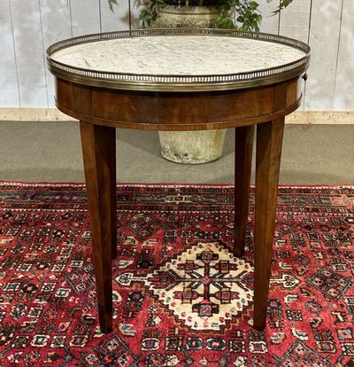 Louis XVI style bouillotte table in mahogany with a white marble top, dating from the 1930s