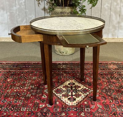 Louis XVI style bouillotte table in mahogany with a white marble top, dating from the 1930s