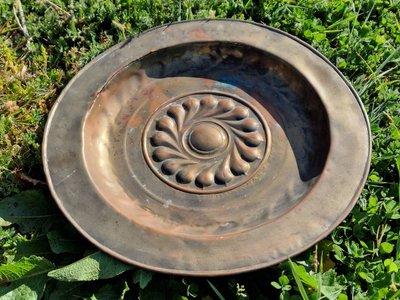 Copper repoussé collection plate, also known as a "quête" plate