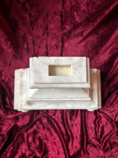 Carved white marble altar base