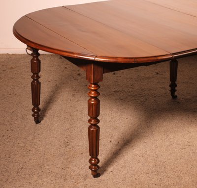 Table de salle à manger extensible du début du 19° siècle en noyer
