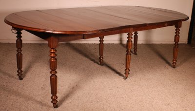 Table de salle à manger extensible du début du 19° siècle en noyer