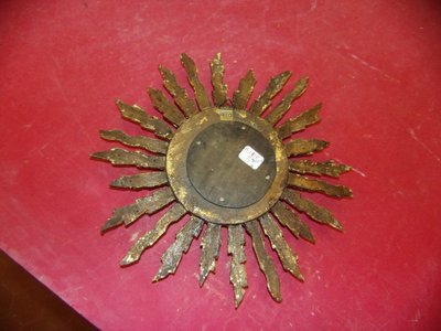 Witch Mirror, late 19th century, gilded wood.