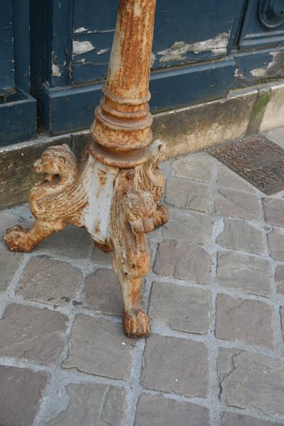 Large cast iron torchiere with griffins from the Restoration XIX period