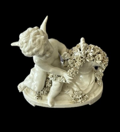 Winged love in Capodimonte porcelain