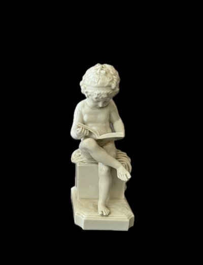 Winged love in Capodimonte porcelain