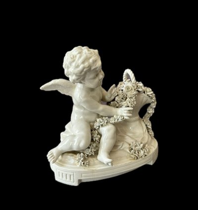 Winged love in Capodimonte porcelain