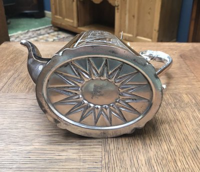 silver-plated metal teapot