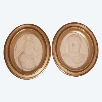 Two marble medallions