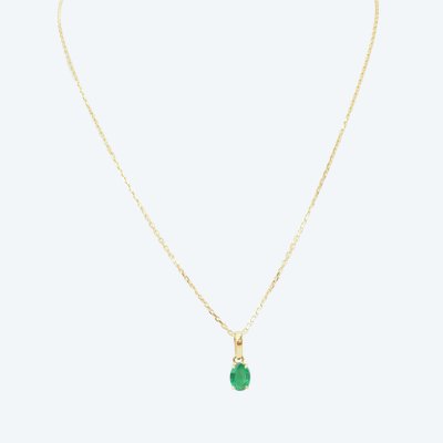 Natural emerald solitaire necklace, 0.65 carat, in yellow gold