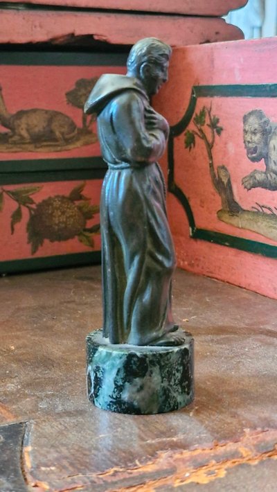 Bronze sculpture depicting a man
