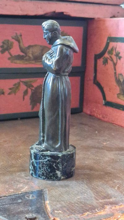 Bronze sculpture depicting a man