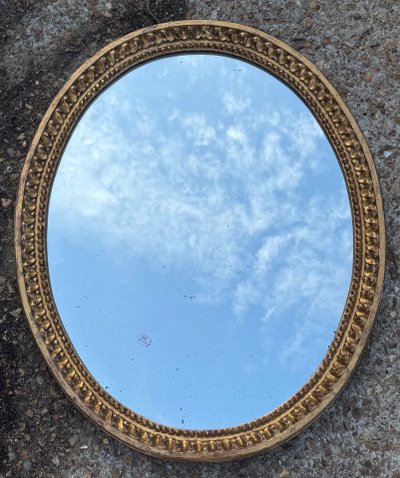 Oval mirror with gold frame