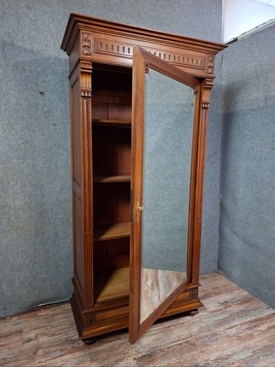 Henri II style mirrored wardrobe in solid walnut, work from the late 19th century.