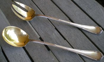 Magnificent salad plate in silver and vermeil model Rubans silversmith Christofle