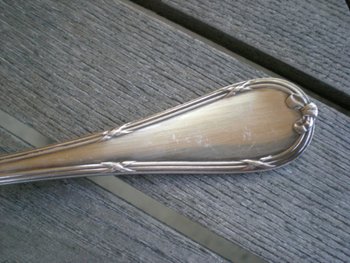 Magnificent salad plate in silver and vermeil model Rubans silversmith Christofle