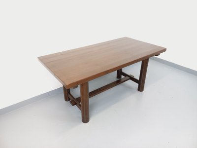 Rectangular Brutalist dining table by Georges Robert, made of dark pine, from the 1950s and 1960s