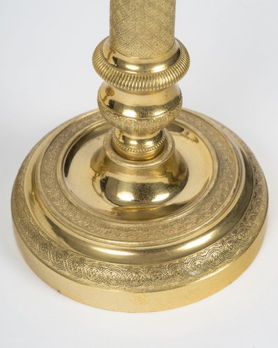 Pair of Louis XVI-style candlesticks in gilded bronze