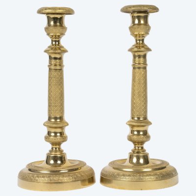 Pair of Louis XVI-style candlesticks in gilded bronze