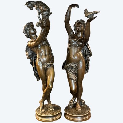 Coppia di sculture in bronzo "Fauno con capretto" e "Donna con colomba" di Ch. GUMERY