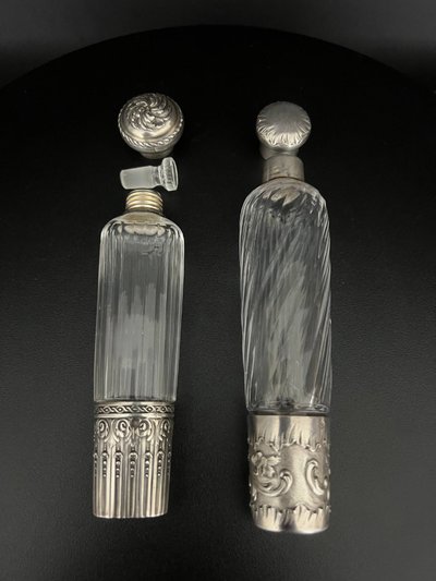 Two travel bottles known as "Eau de Mélisse" in cut crystal and solid silver Minerva