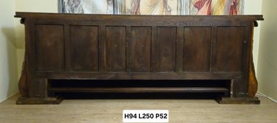 Importante enfilade époque Art Déco en noyer et cuir, reposant sur une élégante base architecturée 