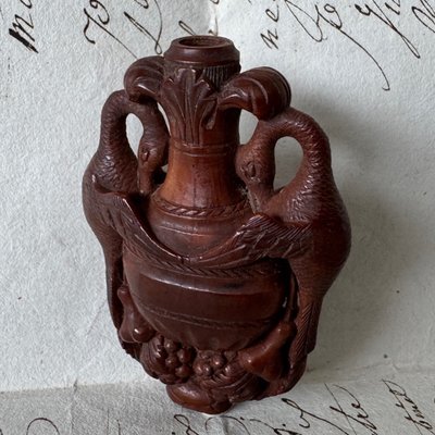 Corozo rocking chair depicting a vase and swans, 19th century