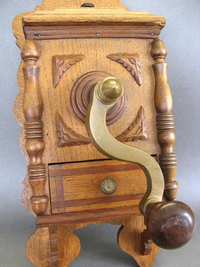 Large wall-mounted coffee grinder from a 19th-century pub.