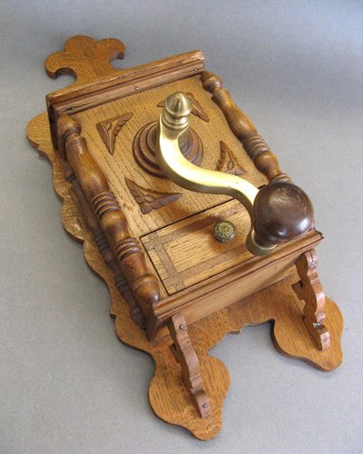 Large wall-mounted coffee grinder from a 19th-century pub.