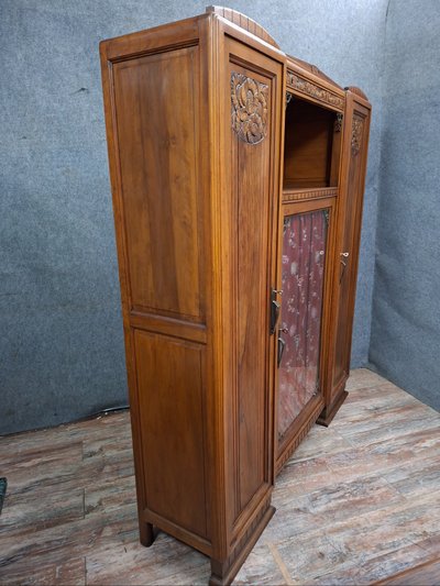 Art Deco bookcase in carved walnut, circa 1930
