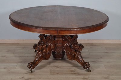Large Renaissance-style carved oak pedestal table, circa 1900