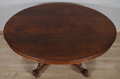 Large Renaissance-style carved oak pedestal table, circa 1900