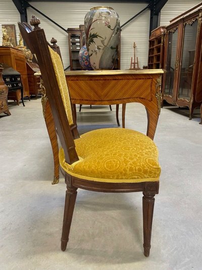 Three Louis XVI-style chairs in molded and carved walnut, 18th century