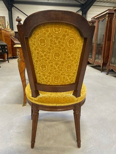 Three Louis XVI-style chairs in molded and carved walnut, 18th century