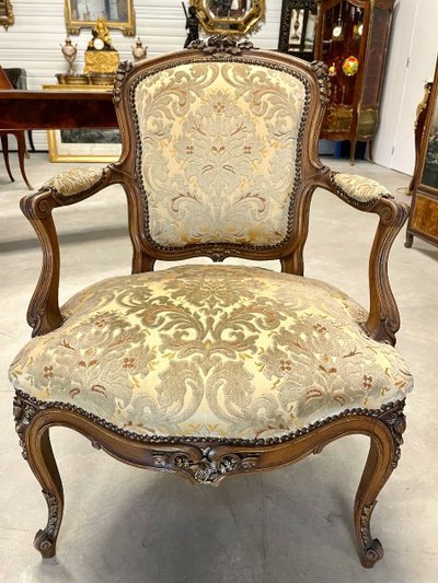 Pair of Louis XV armchairs in carved and gilded walnut, circa 1900