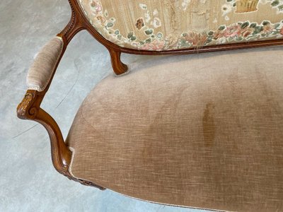 Transition-style sofa in carved beech with a medallion-shaped backrest, circa 1900