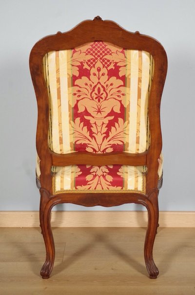 Set of four Regency-style chairs in carved walnut with flat backs, circa 1900