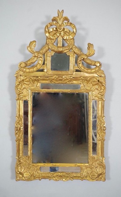 Miroir à parecloses Régence en bois doré, XVIIIe siècle