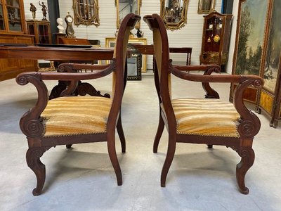 Pair of Restoration-style mahogany armchairs with curved backs, circa 1815