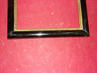 Pair of 19th-century frames, in gilt and black wood
