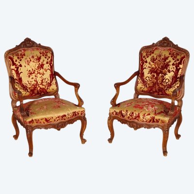 Pair of large Regency armchairs in carved walnut, circa 1900