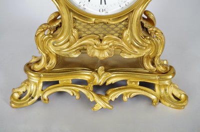 Small Louis XV style cartel clock in gilt bronze, A. Bailly Lyon and Adolphe Mougin