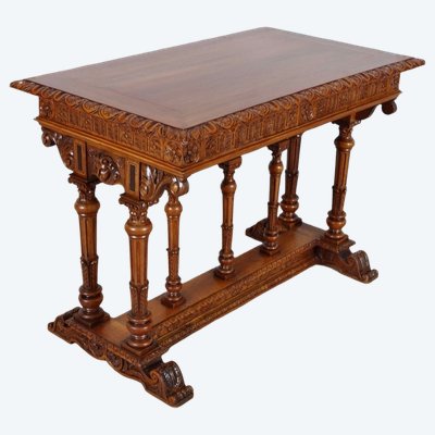 Renaissance writing table in carved walnut, in the style of Dufin