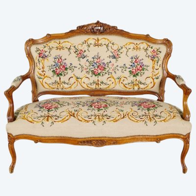 Louis XV style sofa in carved walnut and petit point tapestry, circa 1900