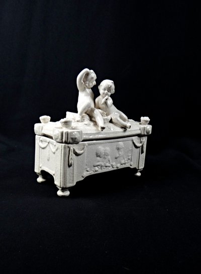 Mid-20th-century crackled earthenware jewelry box with Baroque decoration featuring putti