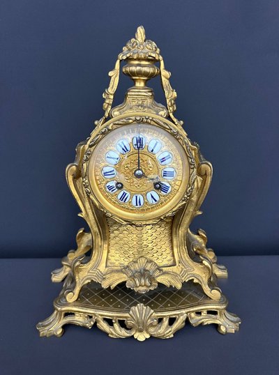 Louis XV-style clock in gilded bronze